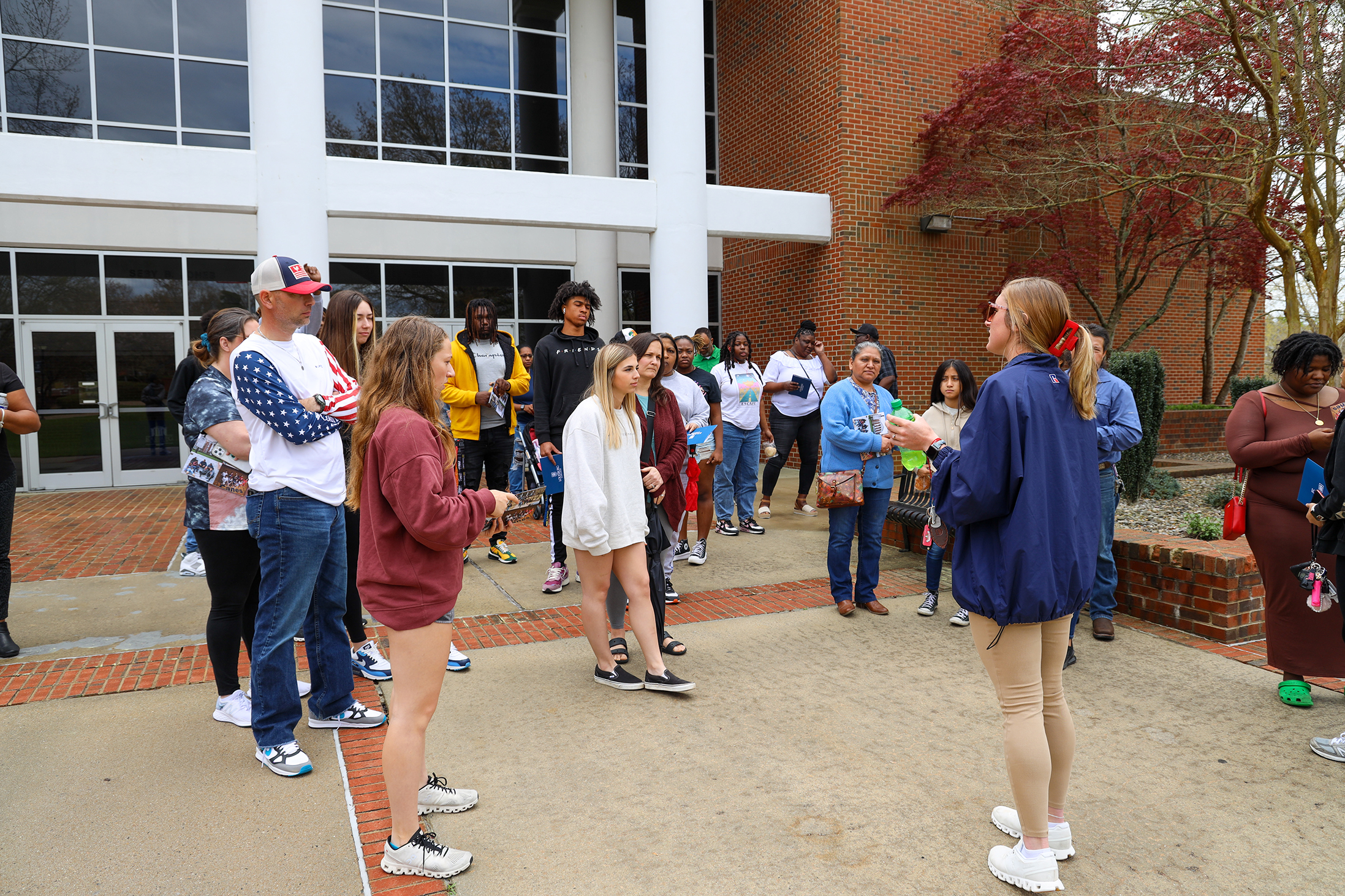 Student leading a group tour.