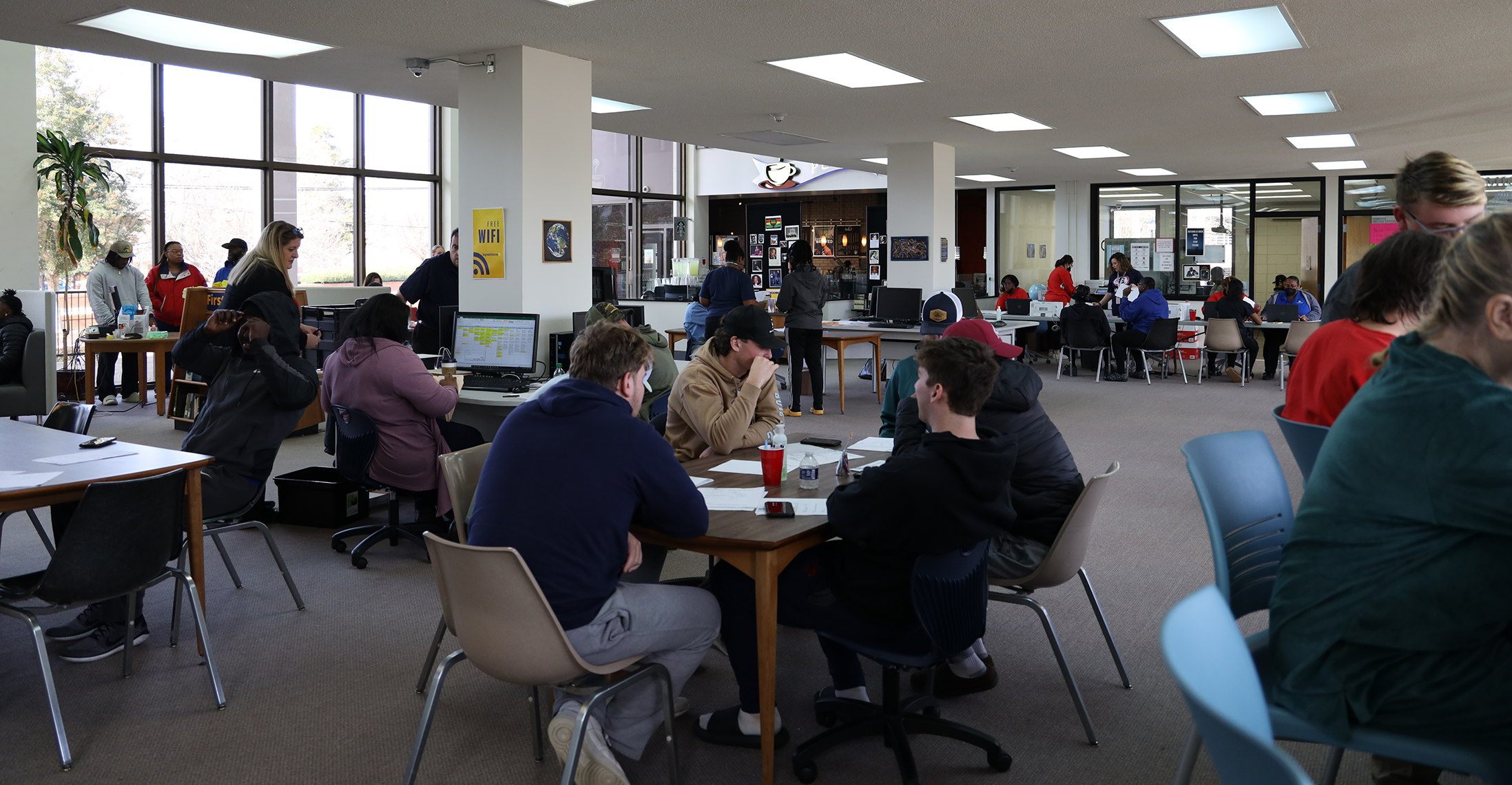 Students in college library during check-in