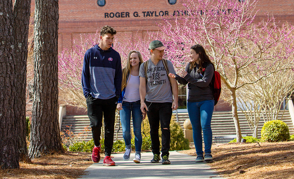 students walking on sidewalk
