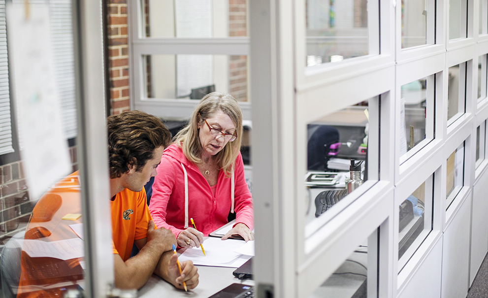 teacher speaking with student