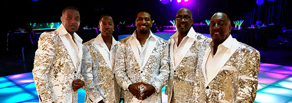 men standing on lit dance floor