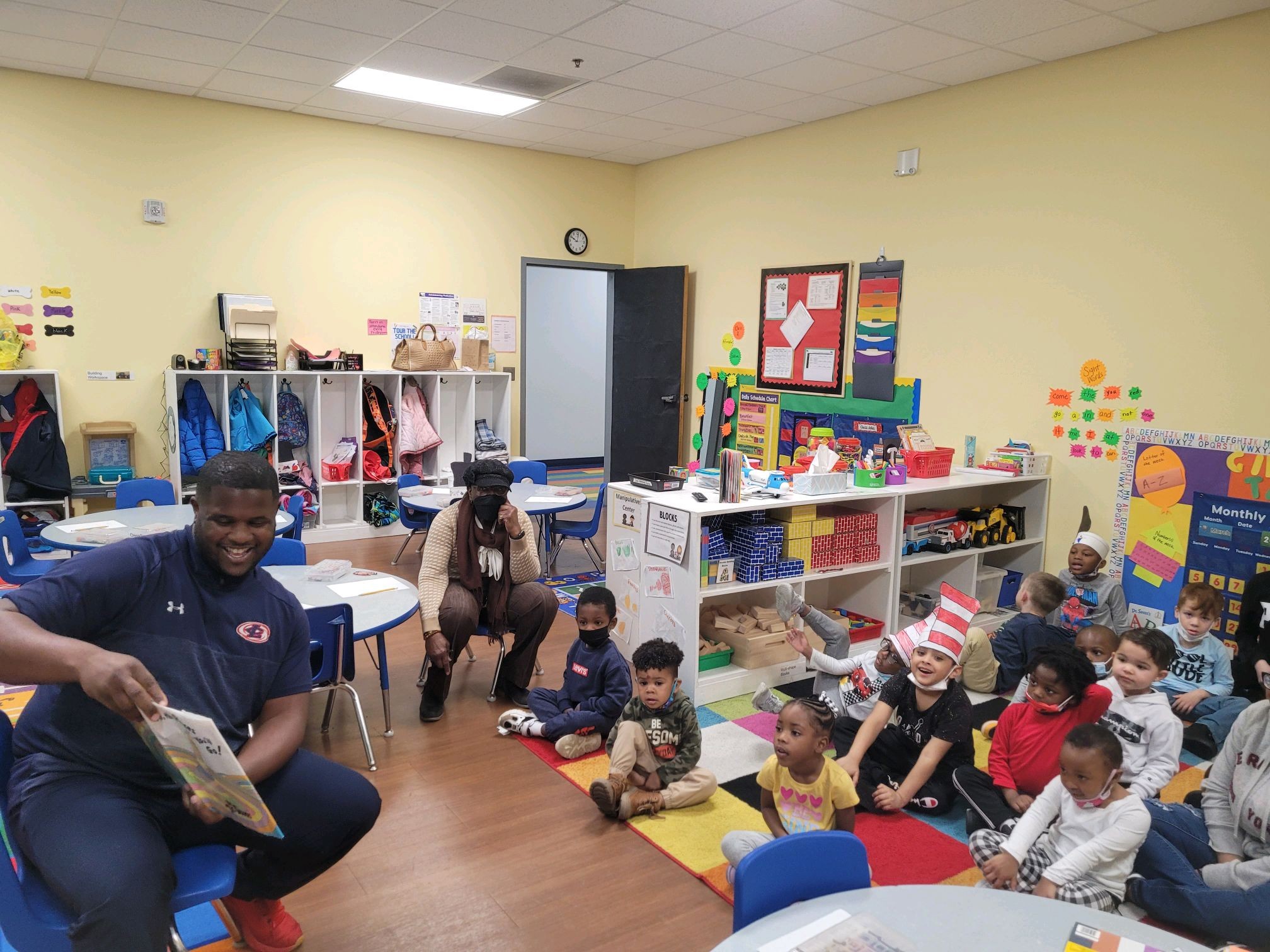 Coach Spellman reading to Pre-K class.